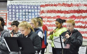 NatHalie Maynock’s fifth-graders play “My Country ‘Tis of Thee” on recorders for a veterans assembly on Nov. 10. From left are Camren Constant
