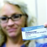 Julia Keegan, health services administrator, holds up a Suboxone strip, a drug the Clallam County jail uses to treat heroin and opioid addicts. The jail was the first on the West Coast and the only in the state to use medically assisted treatment for heroin addicts. (Jesse Major/Peninsula Daily News)