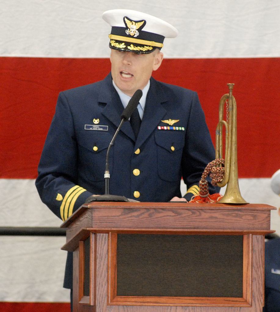 Keith Thorpe/Peninsula Daily News A family heirloom bugle graces the dias as U.S. Coast Guard Cmdr. Mark Hiigel, commanding officer of Air Station/Sector Field Office Port Angeles, speaks during Friday&rsquo;s Veteran&rsquo;s Day ceremony.