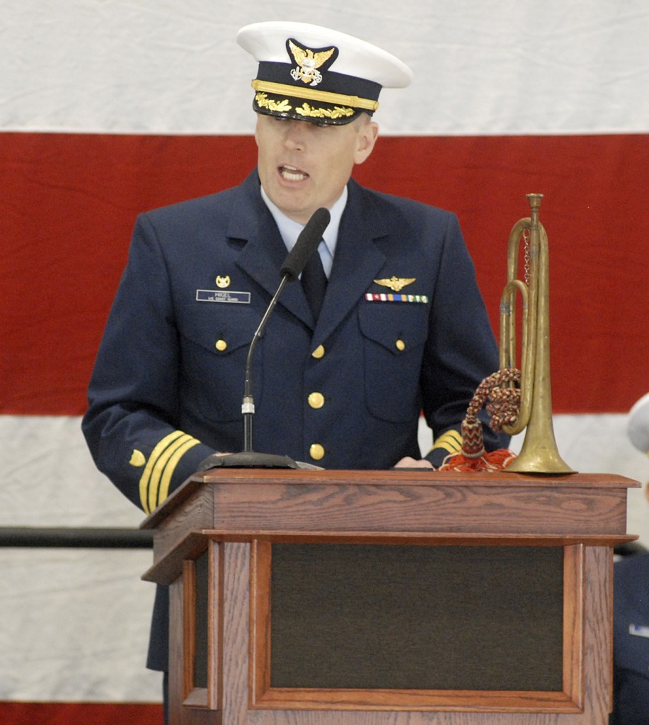 Keith Thorpe/Peninsula Daily News A family heirloom bugle graces the dias as U.S. Coast Guard Cmdr. Mark Hiigel, commanding officer of Air Station/Sector Field Office Port Angeles, speaks during Friday&rsquo;s Veteran&rsquo;s Day ceremony.