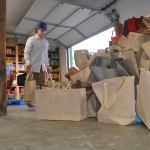 Ethan Richmond, a volunteer for the Sequim Food Bank, carries several bags of food into storage for individuals and families in Sequim to pickup from the facility Friday, Saturday and Monday for Thanksgiving. Staff and volunteers with the food bank anticipate 900 turkeys going into the community from the facility. Sequim Gazette photo by Matthew Nash