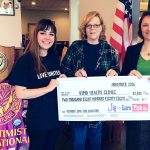 VIMO representative Mary Hogen, center, receives a donation check from Jig and Lure Fish Company employees Sarah Bolen, left, and Christina Fenner at the Soroptomist meeting on Nov. 11. Submitted photo