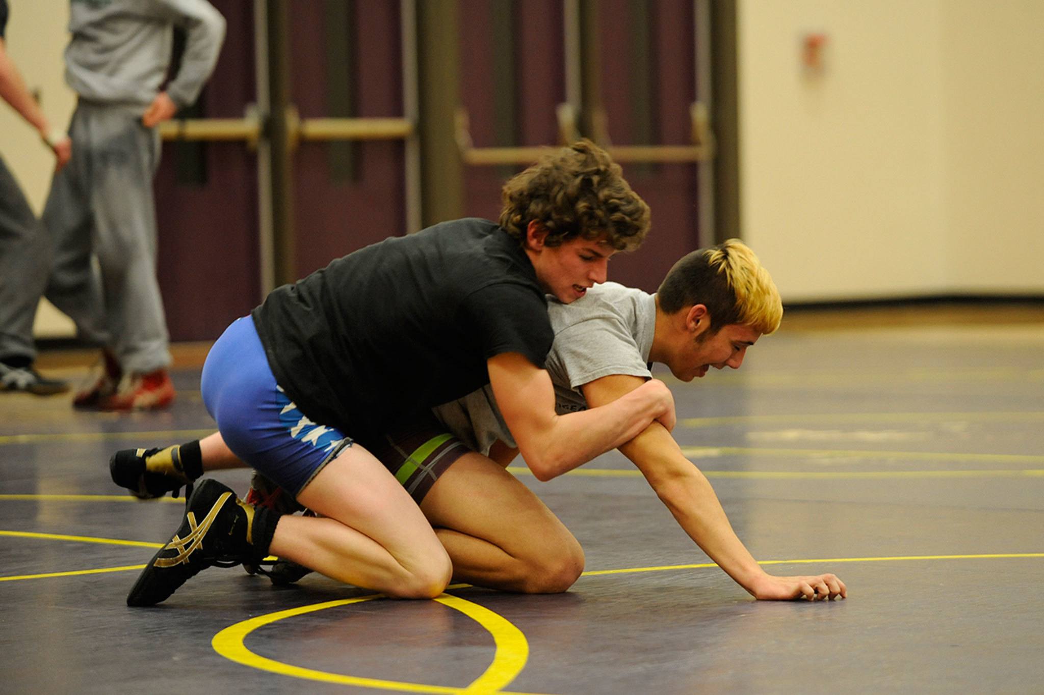 Jamie Schroepfer and Craig Baker practice a takedown in a recent wrestling practice. Sequim 
Gazette photo by Matthew Nash