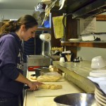 Amber Robb, a cook at Old Mill Cafe, prepares a meal for recent customers. Owners of the restaurant Val and Larry Culp have seen significant drop-off in clientele since construction for the Carlsborg Sewer Project began leading them to cut back on most staff&rsquo;s hours. Sequim Gazette photo by Matthew Nash