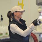 Valerie Horton, manager for the Dungeness Valley Creamery, prepares raw milk jugs for store delivery.