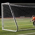 Sequim&rsquo;s Yana Hoesel shoots and sinks one of the Wolves&rsquo; three penalty kicks against Port Angeles&rsquo; Madelyn Wenzl. Sequim Gazette photo by Matthew Nash