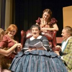 Marmee, played by Colleen Carpenter, reads to her daughters, from left, Amy (Alison Cobb), Beth (Abygail Mundy), Jo (Audrey Hughes) and Meg (Victoria Hall).