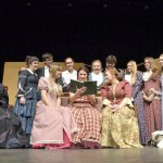 The cast of &ldquo;Little Women&rdquo; centers around Jo (Audrey Hughes) as she reads her published work. Sequim Gazette photos by Matthew Nash