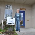 Cecilia Eckerson, lead volunteer for Safe Harbor Drop-In Center, stands outside the facility that offers a safe space for young adults ages 17-24 to relax, use computers and get food.