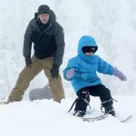 Colby Mackley of Port Angeles watches as his 4-year-old daughter, Rio, skis at Hurricane Ridge on Dec. 18. (Jesse Major/Peninsula Daily News)