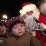 Mason Anderson enjoys a ride on an antique fire truck with Santa Claus and friends for the seventh annual Santa&rsquo;s Toy and Food Brigade.