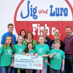 Port Angeles Boys and Girls Club members accept a check for $4,149.86 from the Jig and Lure Fish Company staff, accompanied by United Way and Boys & Girls Club staff. From back left are executive chef Brian Lippert, server Shawna Cochrum, guest services manager Christina Fenner, United Way resource development manager Christy Smith, Boys & Girls Club Port Angeles unit director Ashley Woolsey, and co-owner Stephen Fofanoff. Submitted photo
