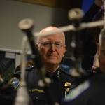 After 45 years in law enforcement, Sequim Police Chief Bill Dickinson retires Dec. 15. Here he listens to the Seattle Police Pipes & Drums group play two songs at a retirement party on Dec. 1. Sequim Gazette photo by Matthew Nash