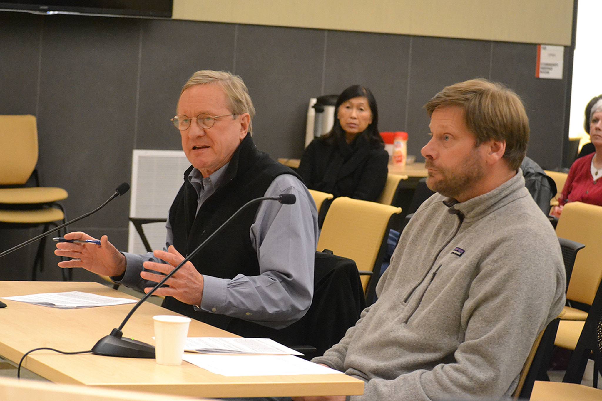 Steve Tharinger, left, and Mike Chapman, state representatives for the 24th District, speak with Sequim City Councilors on Dec. 12 about the city&rsquo;s legislative priorities, which including funding the Simdars Interchange and reforming public information requests. Sequim Gazette photo by Matthew Nash