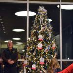 Sequim Mayor Dennis Smith flips the switch for the tree inside the Sequim Civic Center on Dec. 2. Sequim Gazette photo by Matthew Nash