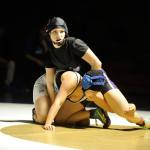 Sequim&rsquo;s Megan Puksta considers her next move in a match-up at 120 pounds with North Mason&rsquo;s Marissa Covarrubias, who went on to win 14-13. Sequim Gazette photo by Matthew Nash