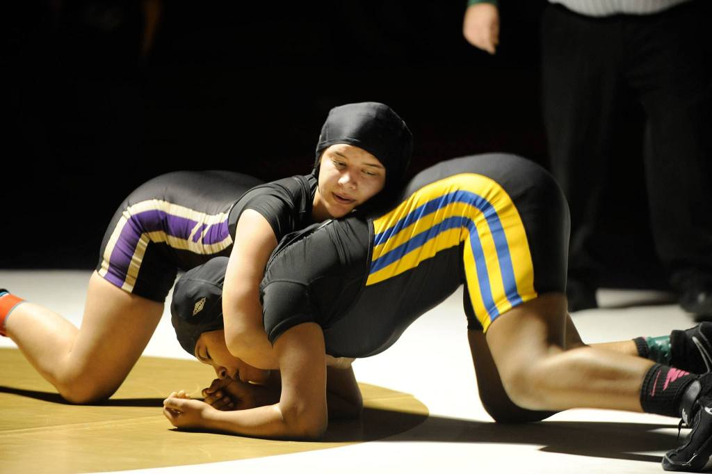 Alma Mendoza, 155, works her way toward a pin of Bremerton&rsquo;s Cynari Green in 3:10 on Thursday, Dec. 15. Sequim Gazette photo by Matthew Nash