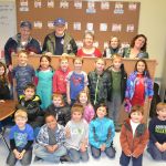 Members of the Sequim-Dungeness Kiwanis, from top left, Wayne Boden, Ted Lund and Philomena Lund stand with Nan Burris of Sequim Community Helping Kids helped coordinate and construct four new bulletin boards for Jennifer Saul, top right, and her first-grade classroom in Helen Haller Elementary. Sequim Gazette photo by Matthew Nash