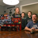 The Gray family, from left, Janet, Jamison, 10, Jaxson, 12, and Jon, gather in their dining room with some of Jon&rsquo;s most recent &ldquo;Star Wars&rdquo; figures. He&rsquo;s likely one of the biggest collectors in the area. Sequim Gazette photo by Matthew Nash