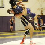 Sequim&rsquo;s Travis Baker takes North Kitsap&rsquo;s 152-pounder Kye Ryan to the mat before earning a second round pin in Sequim&rsquo;s 52-18 win on Dec. 14. Sequim Gazette photos by Michael Dashiell