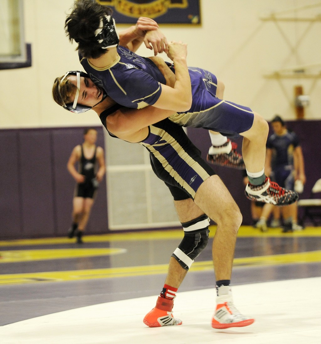 Sequim&rsquo;s Travis Baker takes North Kitsap&rsquo;s 152-pounder Kye Ryan to the mat before earning a second round pin in Sequim&rsquo;s 52-18 win on Dec. 14. Sequim Gazette photos by Michael Dashiell