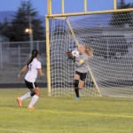 Matthew Nash/Olympic Peninsula News Group                                Sequim&rsquo;s Claire Henninger (with ball) makes a save during an early-season contest.
