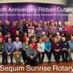 Sequim Sunrose Rotary members and Sequim Ambassadors with the Sequim-Dungeness Valley Chamber of Commerce celebrate the club&rsquo;s 30th anniversary with a ribbon cutting on Jan. 13. Photos courtesy of Sequim Sunrise Rotary