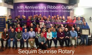Sequim Sunrose Rotary members and Sequim Ambassadors with the Sequim-Dungeness Valley Chamber of Commerce celebrate the club&rsquo;s 30th anniversary with a ribbon cutting on Jan. 13. Photos courtesy of Sequim Sunrise Rotary