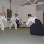 Chief Aikido instructor Neilu Naini leads her students Andy Brastad, left, and William Jevne, right, during a warm-up exercise at the Aikido Dojo off Carlsborg Road in Sequim. Sequim Gazette photos by Erin Hawkins