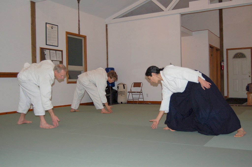 Chief Aikido instructor Neilu Naini leads her students Andy Brastad, left, and William Jevne, right, during a warm-up exercise at the Aikido Dojo off Carlsborg Road in Sequim. Sequim Gazette photos by Erin Hawkins