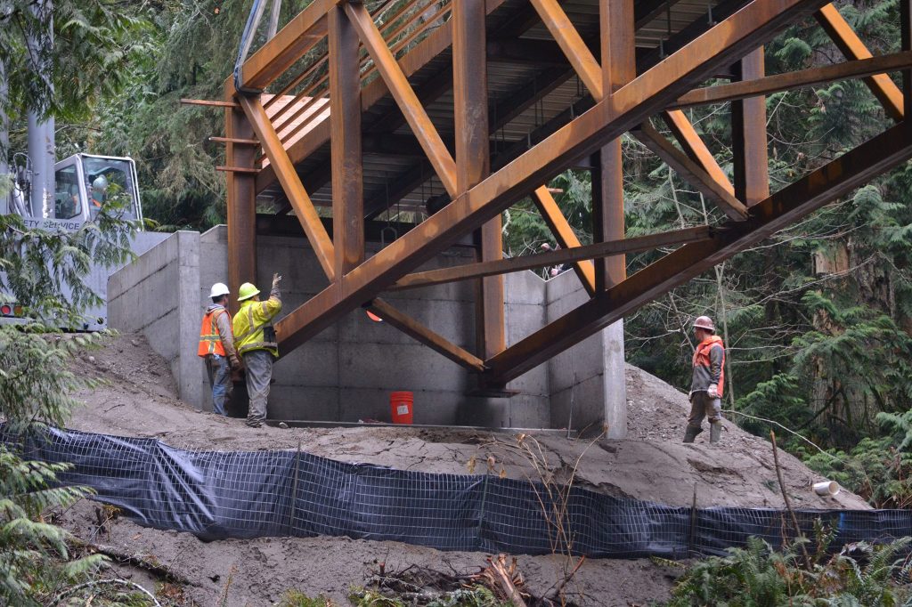The new bridge in Sequim Bay State Park spans 210 feet in three sections and weighs 177,000 pounds. Sequim Gazette photo by Matthew Nash