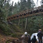Park officials watch crewmen place a new bridge in Sequim Bay State Park on Jan. 19. Sequim Gazette photo by Matthew Nash