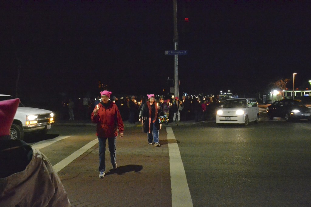 Locals gather in the evening of Jan. 21, at the southeast corner of Washington Street and Sequim Avenue for women&rsquo;s rights. Organizers estimate more than 100 people attended. Sequim Gazette photos by Matthew Nash