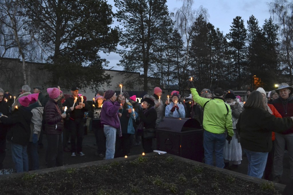 Locals gather in the evening of Jan. 21, at the southeast corner of Washington Street and Sequim Avenue for women&rsquo;s rights. Organizers estimate more than 100 people attended. Sequim Gazette photos by Matthew Nash