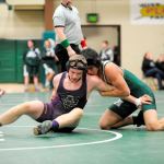 Austin Budd, 170 pounds, looks to escape a match with Thomas Blevins on Jan. 12. He went on to win 14-10. Sequim Gazette photo by Matthew Nash
