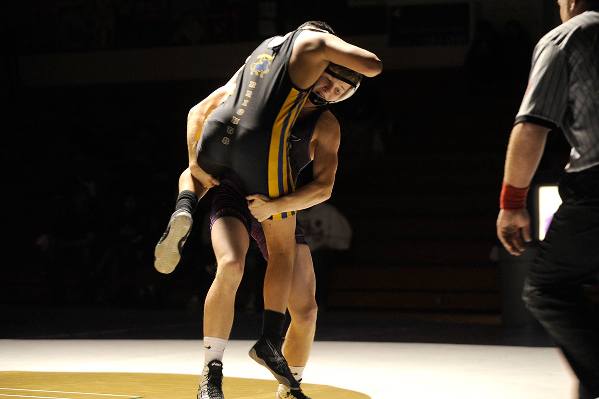 Sequim&rsquo;s Ben Newell, 132 pounds, picks up Bremerton&rsquo;s Alex Mafnas during their match on Jan. 5 in Sequim. Newell went on to pin Mafnas in 1:22. Sequim Gazette photo by Matthew Nash