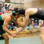 Rudy Valdez of Port Angeles and Sequim&rsquo;s Murray Bingham look to make a take down during the Battle for the Axe on Jan. 12. Bingham won the match 6-4. Sequim Gazette photo by Matthew Nash