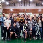Sequim wrestlers and coaches hold the trophy from Port Angeles&rsquo; Battle for the Axe on Jan. 12. The Wolves took the title from Port Angeles after defeating them in the first round of a four-way dual that included Forks and Port Townsend.                                 Submitted photo