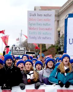 Students from the University of Mary in Bismarck, N.D., carry a banner at the front of the national March for Life.
