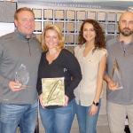 Strait Floors is proud to have earned the prestigious 2016 National Dealer of the Year and other awards. From left are owners Steve and Hayley Wilson, interior designer Keli Haffner and owner Chad Copeland. Sequim Gazette photo by Patricia Morrison Coate