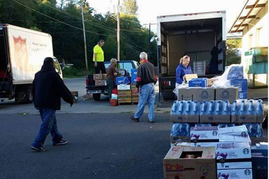 Officials with Forks Food bank, Sequim Food Bank, Salvation Army, Port Angeles Food Bank, and Serenity House load supplies from Food Lifeline on Jan. 31, at Port Angeles Food Bank. Different agencies gather there weekly to pickup supplies and distribute abundant items. Photo courtesy of Jessica Hernandez