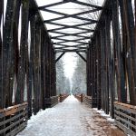 The snow continued to fall this afternoon in Sequim including at the Dungeness River Railroad Bridge. Sequim Gazette photo by Matthew Nash