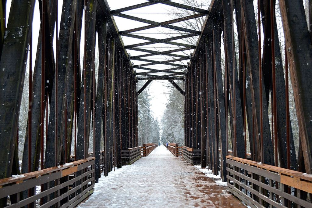 The snow continued to fall this afternoon in Sequim including at the Dungeness River Railroad Bridge. Sequim Gazette photo by Matthew Nash