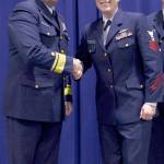 Rear Adm. Mark Butt, commander of the Coast Guard 13th District, shakes hands with Petty Officer 1st Class Tara Dodd after she was announced as the enlisted person of the year at a ceremony held at Coast Guard Base Seattle last week. (Amanda Norcross/U.S. Coast Guard)