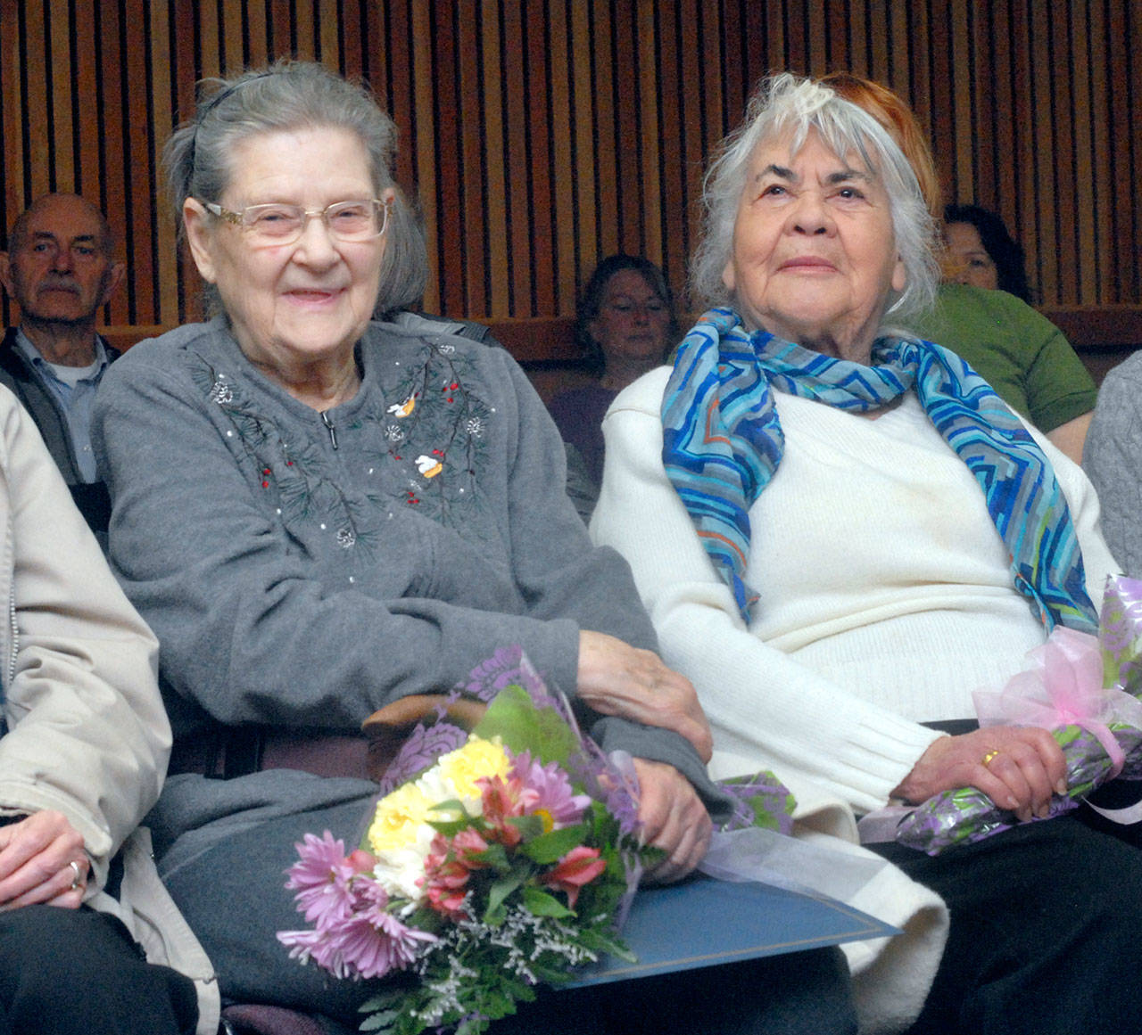 American Red Cross volunteers Jo Oliver, left, and Dianna Cross sit in commissioners meeting room at the Clallam County Courthouse in Port Angeles after being honored by the commission for their long-standing service with the disaster-relief agency. Keith Thorpe/Peninsula Daily News