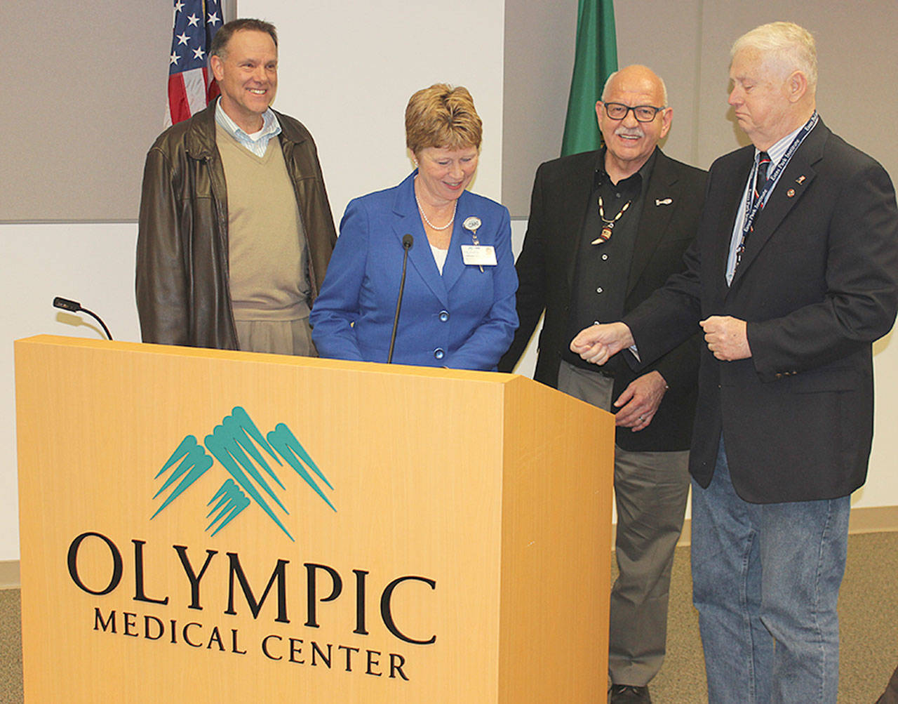 OMC hospital commissioner chairman Jim Leskinovitch (right) and assistant administrator Lorraine Wall (second from left) discuss the foundation&rsquo;s gift to OMC with foundation president Jim Jones (left) and foundation board member and supporter Ron Allen (second from right) at the March 15 commissioners meeting. Submitted photo