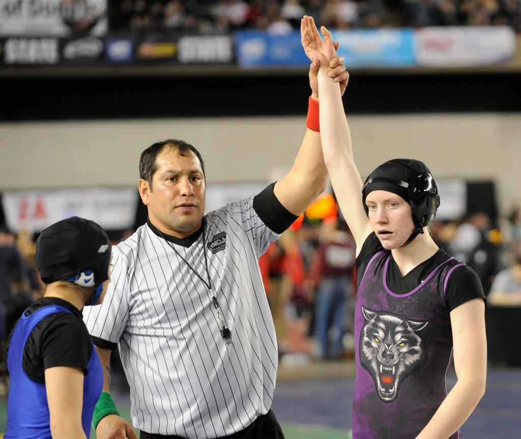 Kiara Pierson receives a win in the first round of the 120-pound girls bracket at the state MatClassic on Feb. 17, in the Tacoma Dome. She pinned Alexis Mendoza of Warden and went on to take third in the tournament.