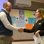 Brian Kuh shakes hands with Robin Henrikson, board president for the Sequim School Board, on Monday, March 20, after he was sworn in as a new board director. He replaces Bev Horan who stepped down on March 7. Sequim Gazette photo by Matthew Nash