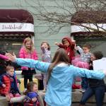 Emily Sly reads &ldquo;Beautiful Hands&rdquo; to a group of families for the &ldquo;Love Sparkle the World&rdquo; project on March 20 in Seal Street Park that encourages families to show children they are loved through reading. Sequim Gazette photo by Matthew Nash