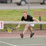 Sequim&rsquo;s Stephanie LaCour scoops up the ball to save a shot against Port Angeles&rsquo; Summer Olsen on April 19. LaCour won in three sets 3-6, 7-5, 6-0. Sequim Gazette photo by Matthew Nash